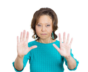 Senior business woman asking to stop, hand gesture