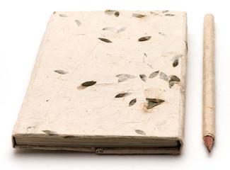 Notepad and pencil on white background
