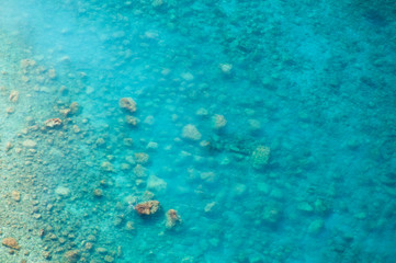 Fototapeta na wymiar Clean clear sea Turkey, top view of the water and seabed