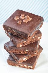 a pile of nutty milk chocolate coated brownies