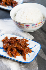 korean sweet and spicy beef strips with plain rice