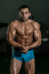 Fototapeta na wymiar Bodybuilder Performing Most Muscular Poses