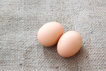 eggs on sackcloth of background.