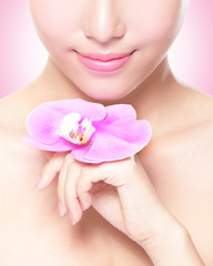 beautiful face with pink orchids