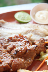 grilled pork steak with french fries and toast.