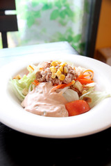 tuna and vegetable salad in dish.