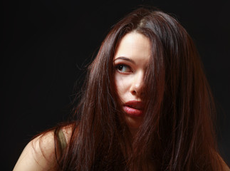 Depressed woman , isolated on black background.