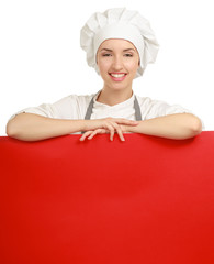 Happy woman cook or baker holding over paper sign billboard.