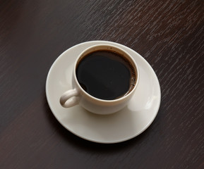 Cup of coffee at workplace.