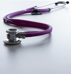 A stethoscope on white, closeup.