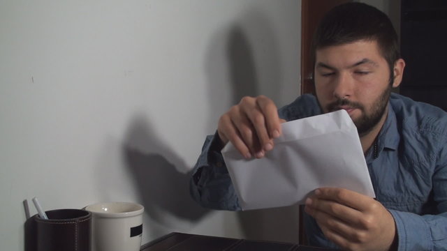 Business Man Opening An Envelope And Receiving Good News