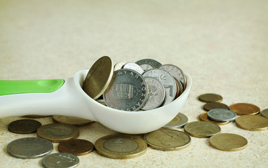 Spoon full of money
