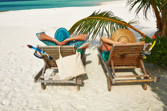 Couple in green on a beach at Maldives