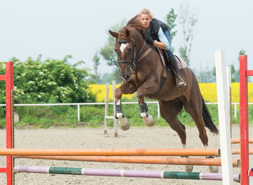 girl jumping with horse