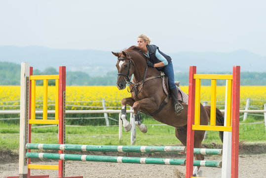 girl jumping with horse
