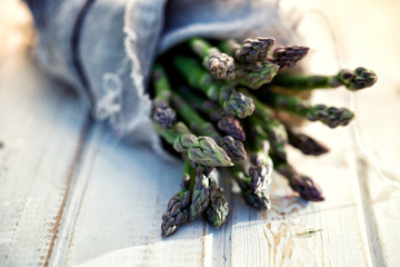 Bunch of fresh asparagus on wooden table