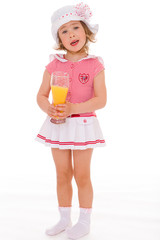 charming little girl with a glass of juice.