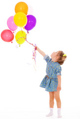Charming girl with balloons.