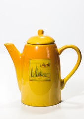 Yellow teapot on a white background