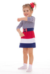 charming little girl posing in studio.