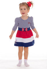 charming little girl posing in studio.