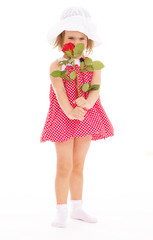 cheerful little girl in a pink dress.