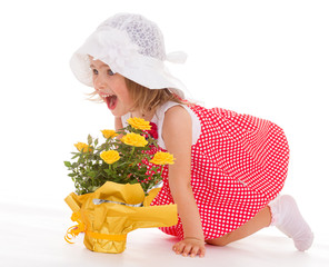 cheerful little girl in a pink dress.