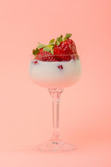 fresh strawberries on a glass with cream