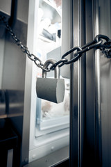 photo of metal lock hanging on refrigerator door
