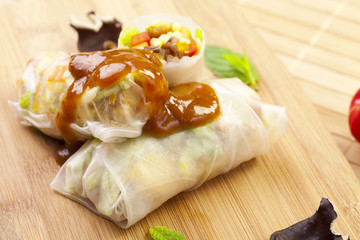 Portion of spring rolls on a bamboo board