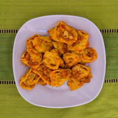 Cappellacci with ragù pasta stuffed with pumpkin