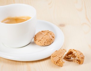 cup of italian espresso coffee near biscuit