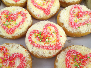 A lot of donut and strawberry jam