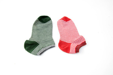 green and red striped socks isolated on white