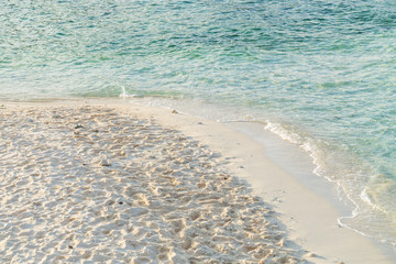 Wave of the sea on the sand beach