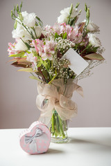 gift and flower on table