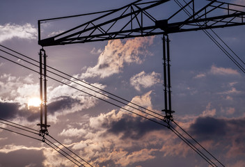 Fototapeta na wymiar Power line pylon and sun