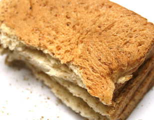 slice of bread with crumbs; isolated; white background