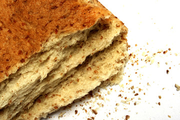 slice of bread with crumbs; isolated; white background
