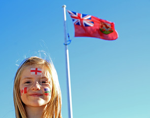 Young girl with the Bermuda flag in the background