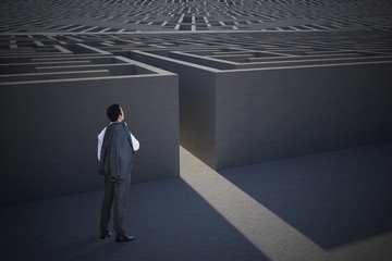 Composite image of businessman standing