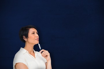 Fototapeta premium Composite image of thoughtful businesswoman