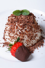 panna cotta and strawberries in chocolate. vertical. top view