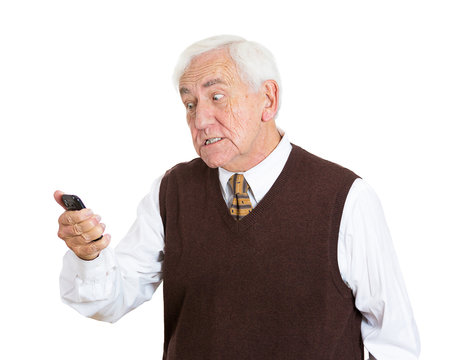 Portrait angry old man pissed off at a phone conversation