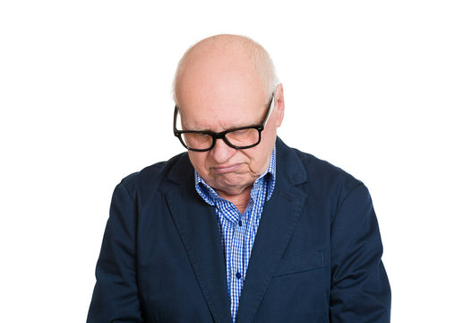 Portrait upset depressed old man isolated on white background 