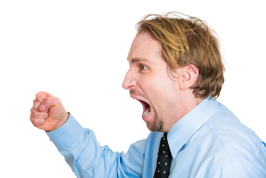 Side view Portrait, headshot Angry man screaming at someone