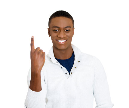 Portrait handsome man giving number one sign, pointing finger up
