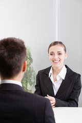 Business people having job interview with young woman. - 64489143