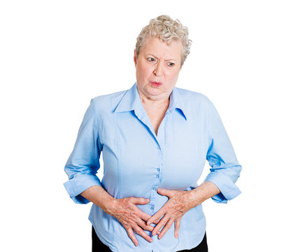 Abdomen Pain. Senior Woman Has Stomach Pain, On White