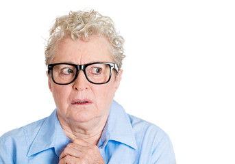 Paranoia. Deranged, anxious, senior elderly woman with glasses